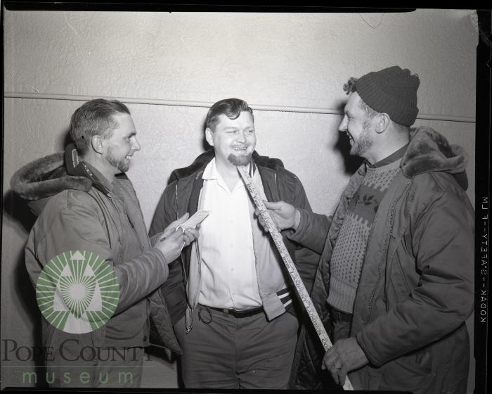 Ray Kolledge Measures Bill Birney's Whiskers. Glenwood, Minnesota