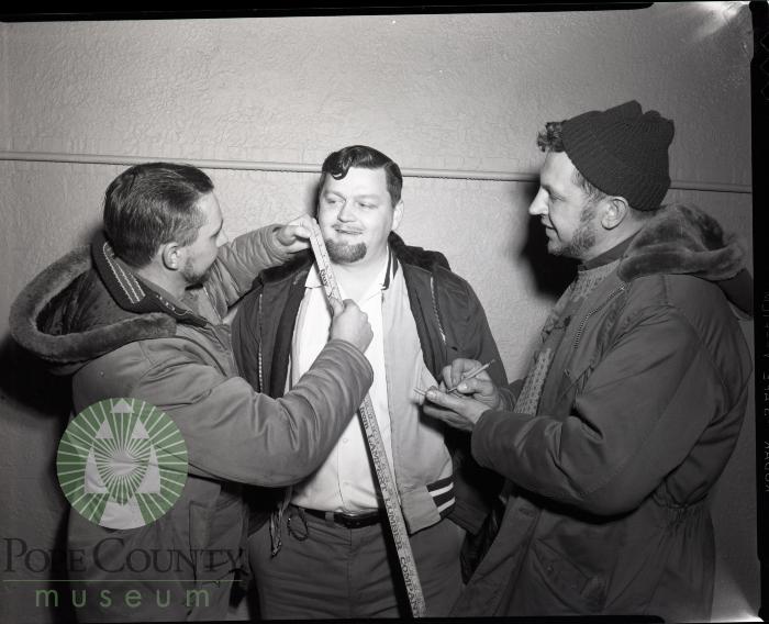 Jim Holtberg Measures Bill Birney's Whiskers. Glenwood, Minnesota