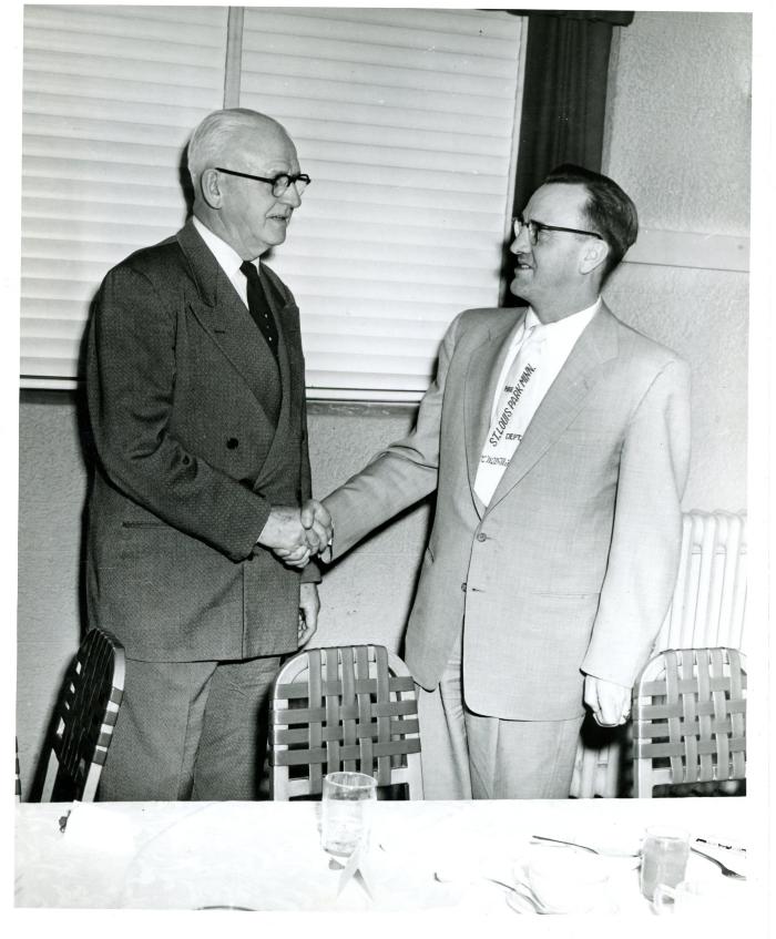 Herman Bolmgren and Pete Williams shaking hands , April 4, 1954