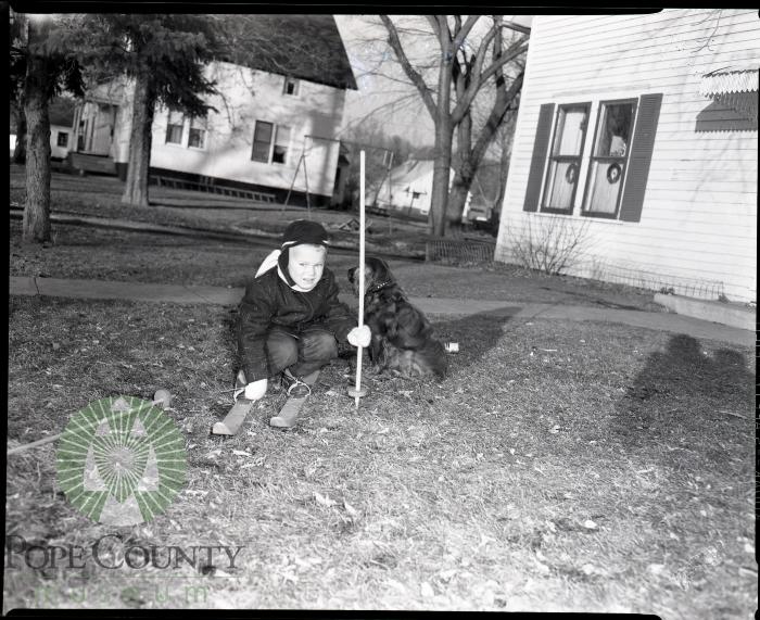 Billy Lee receives new skis for Christmas, Glenwood, Minnesota