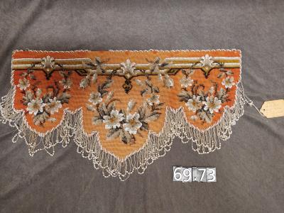Needlepoint and beaded shelf valance.
