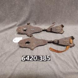 Pair of clip-on ice skates.