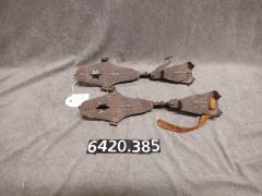 Pair of clip-on ice skates.