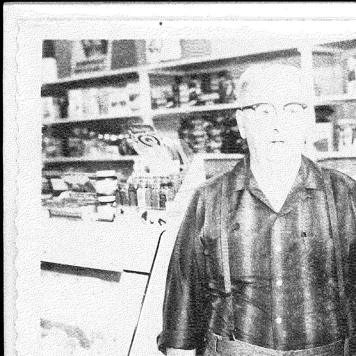 Snapshot of Lewis K. Lee in his store in Kasson, Mn.
