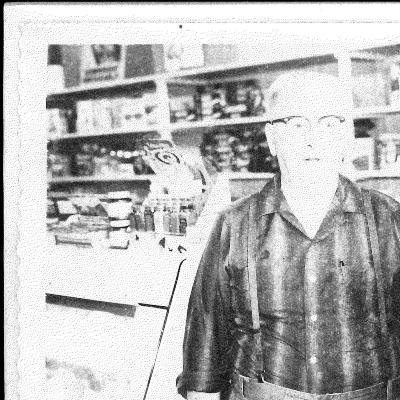 Snapshot of Lewis K. Lee in his store in Kasson, Mn.