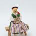 Doll Knitting on Bench: Doll
