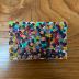 Paint-splattered artist's canvas board