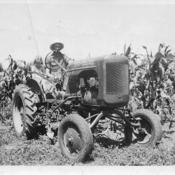 Photo of LuAnn and Chuck (Charles) Kramer on a tractor