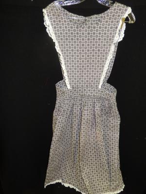Apron with bib. white ruffle around, gathered skirt black and white daisy print.