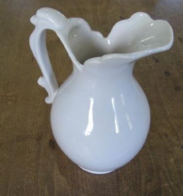  White porcelain water pitcher with the words "Royal, Hagger, USA