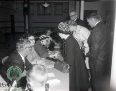 Mr. and Mrs. Orvald Forbord, Audrey Kinney and Rachel Spencer Doing Registration