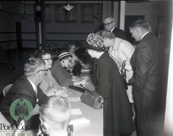 Mr. and Mrs. Orvald Forbord, Audrey Kinney and Rachel Spencer Doing Registration