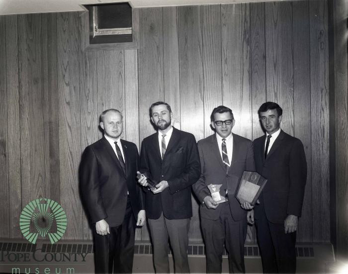 Dick Kaus and Marv Bodeker Receiving Jaycee Awards From Dr. Howard Lecander And Lanny Barsness. 