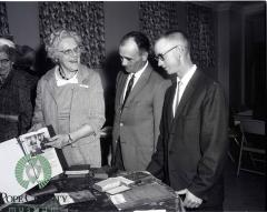 Olivia Peterson Showing Gordon Moe And Allen Nygaard Artifacts and Pictures of the Church