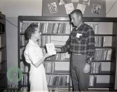 Bob O'Fallon Presenting "The Climate Is Hope" Book to Irene Serrin 