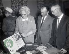 Olivia Peterson showing a display of artifacts and photo's of Indherred Lutheran Church