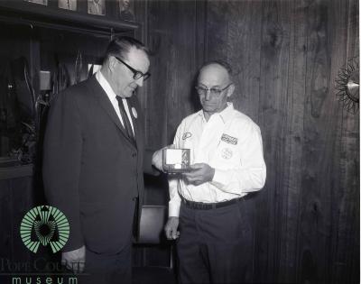  Harvey Gloege Presenting An Oldsmobile Goldwatch to Bill Bodeker a 10 Year Oldsmobile Serviceman