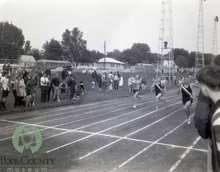 Dave Suedal and Greg Lokken from Moorhead racing in 220 meter dash