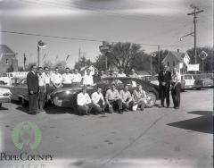 Members of the Gloege Chevrolet staff with Harvey and Dennis Gloege at the Gloege Chevrolet 20th anniversary  