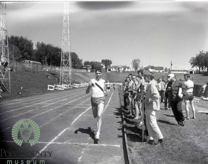 Unidentified male competing in a running event at Glenwood High School Track Meet