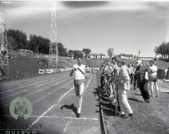 Unidentified male competing in a running event at Glenwood High School Track Meet