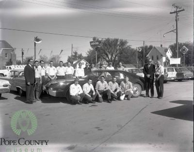 Members of the Gloege Chevrolet staff with Harvey and Dennis Gloege at the Gloege Chevrolet 20th anniversary  