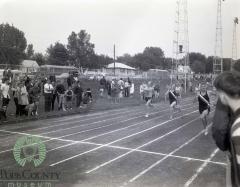 Dave Suedal and Greg Lokken from Moorhead racing in 220 meter dash