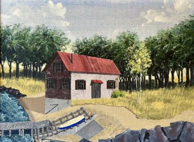 Building by lake with rocky shore and boat on dock