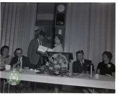 Ardis Stone receiving a gift from Bob O'Fallon on behalf of the Auxiliary unit