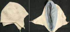 Ivory knitted baby cap lined with blue and white plaid cloth
