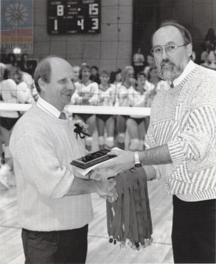 Unknow man receiving award