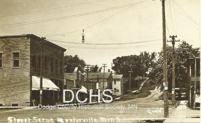 Black and white picture postcard of Mantorville main street looking north