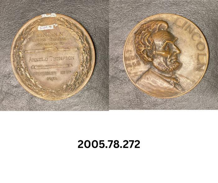 Paperweight - Lincoln Essay Medal awarded to Arnold Thompson