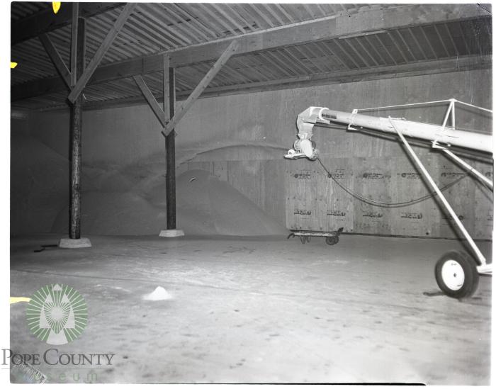 Fertilizer piles inside new warehouse owned by McLead Co.