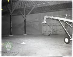 Fertilizer piles inside new warehouse owned by McLead Co.