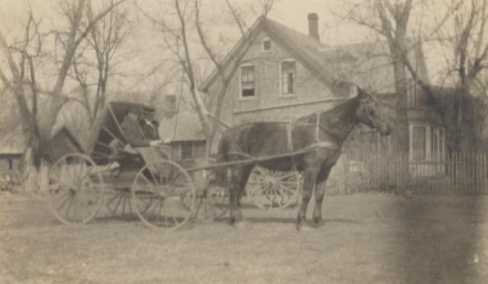 Aaron Pearson and Geoline Pearson in a horse and buggy