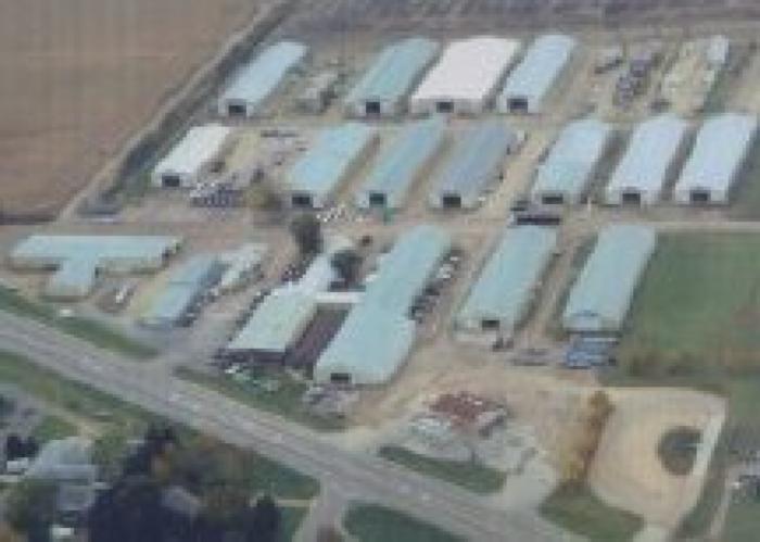 Aerial view of 18 Sheds of Hewitt Lifts and Roll-A-Dock Manufacturing in Nicollet, MN; 2004