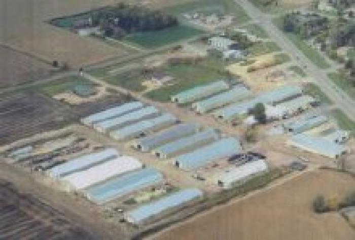 Aerial view of 18 Sheds of Hewitt Lifts and Roll-A-Dock Manufacturing in Nicollet, MN; 2004