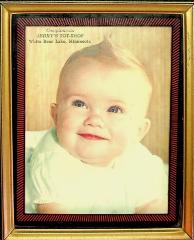 Framed baby picture advertising Jerry's Tot-Shop in White Bear Lake