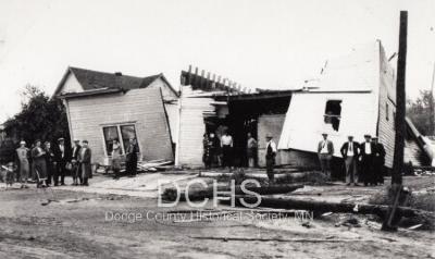 Black and white photograph of several damaged buildings