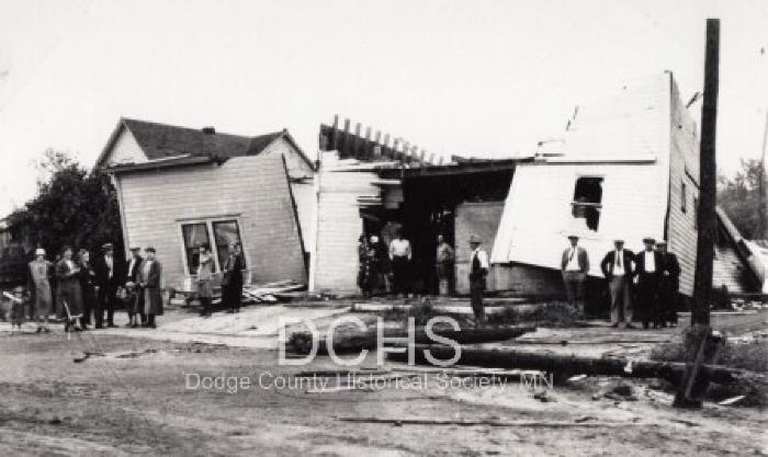 Black and white photograph of several damaged buildings