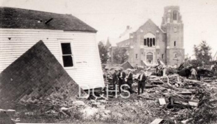 Black and white photograph of debris in front of Trinity Church