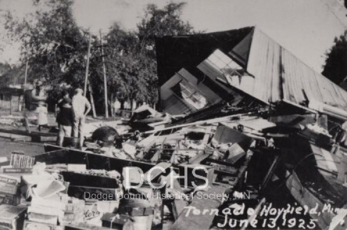 Black and white photograph of tornado damaged buildings