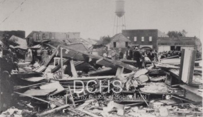 Black and white photograph of buildings damaged by tornado