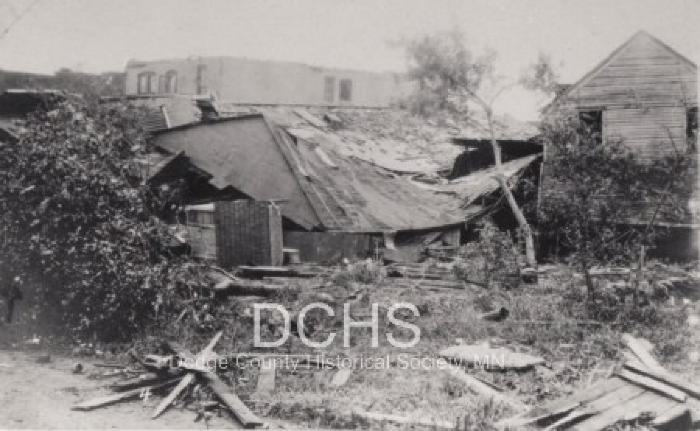 Black and white photograph of buildings damaged by tornado