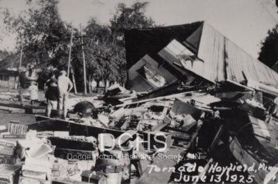 Black and white photograph of tornado damaged building