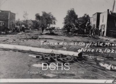 Black and white photograph of debris in street from tornado