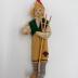 Doll with Rake and Green Vest: Doll