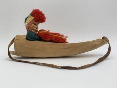 Sami Man in Sled: Wood Carving
