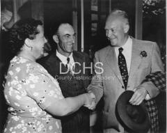 Black and white photograph of Eisenhower shaking hands iwth Clara Snow